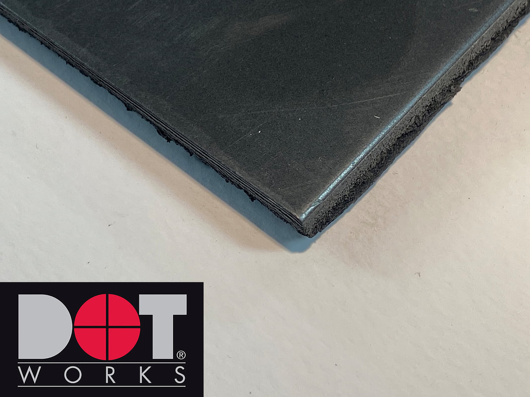 close up of DotWorks black PVC foam board lined